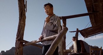 Movie still from “One-Eyed Jacks” (1961), directed by Marlon Brando – An older man standing next to an old man; Medium shot, Low angle