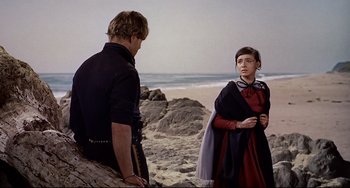 Movie still from “One-Eyed Jacks” (1961), directed by Marlon Brando – A man and a woman standing on the beach; Medium shot, Over the shoulder angle