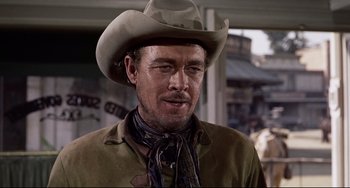 Movie still from “One-Eyed Jacks” (1961), directed by Marlon Brando – A man in a cowboy hat and a brown jacket; Close Up shot, Over the shoulder angle