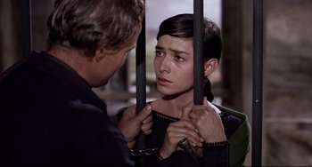 Movie still from “One-Eyed Jacks” (1961), directed by Marlon Brando – A man and a woman are holding on to chains; Close Up shot, Over the shoulder angle