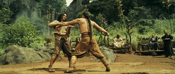 Movie still from “Ong Bak 2” (2008), directed by Tony Jaa – Two native american men fighting in the desert; Wide shot, Low angle
