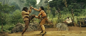 Movie still from “Ong Bak 2” (2008), directed by Tony Jaa – Two men are fighting in the middle of the jungle; Wide shot, Low angle