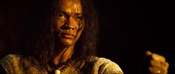 Movie still from “Ong Bak 2” (2008), directed by Tony Jaa – A person with long black hair; Close Up shot, Low angle