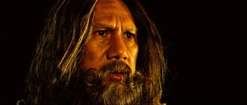 Movie still from “Ong Bak 2” (2008), directed by Tony Jaa – A man with long hair and a long beard; Close Up shot, Low angle