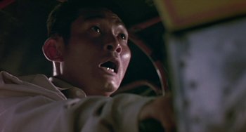 Movie still from “Ong-Bak: The Thai Warrior” (2003), directed by Prachya Pinkaew – A person in a car with his eyes wide open; Close Up shot, Low angle
