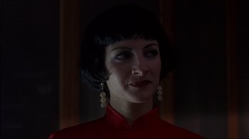 Movie still from “Open Your Eyes” (1997), directed by Alejandro Amenábar – A woman in a red dress with short hair; Close Up shot, Low angle