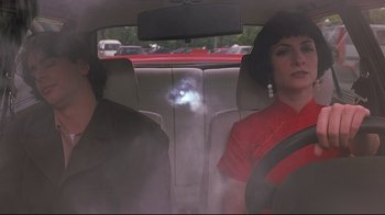 Movie still from “Open Your Eyes” (1997), directed by Alejandro Amenábar – A woman and a man sitting in the back seat of a car; Medium shot, Over the shoulder angle