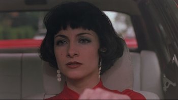 Movie still from “Open Your Eyes” (1997), directed by Alejandro Amenábar – A person sitting in a car; Close Up shot, Over the shoulder angle