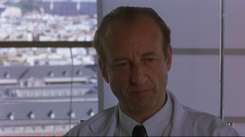 Movie still from “Open Your Eyes” (1997), directed by Alejandro Amenábar – A person wearing a lab coat; Close Up shot, Low angle