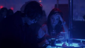 Movie still from “Open Your Eyes” (1997), directed by Alejandro Amenábar – Two people sitting at a table looking at their cell phones; Medium shot, Over the shoulder angle
