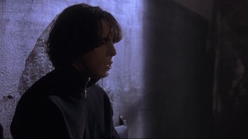 Movie still from “Open Your Eyes” (1997), directed by Alejandro Amenábar – A woman is looking out a window at night; Close Up shot, Low angle