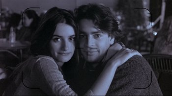 Movie still from “Open Your Eyes” (1997), directed by Alejandro Amenábar – A man and a woman posing for a picture; Close Up shot, High angle