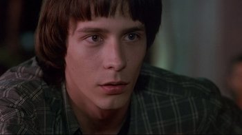 Movie still from “Open Your Eyes” (1997), directed by Alejandro Amenábar – A person wearing a plaid shirt; Close Up shot, Low angle