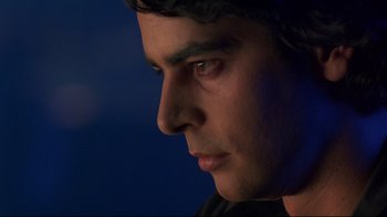 Movie still from “Open Your Eyes” (1997), directed by Alejandro Amenábar – A man's face in the dark; Close Up shot, Over the shoulder angle