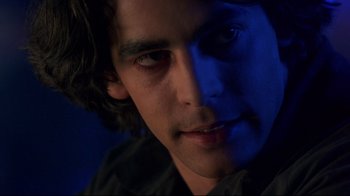 Movie still from “Open Your Eyes” (1997), directed by Alejandro Amenábar – A young man's face in the dark; Close Up shot, Over the shoulder angle