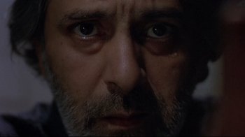 Movie still from “Open Your Eyes” (1997), directed by Alejandro Amenábar – A man's eyes and face in the dark; Extreme Close Up shot, Low angle
