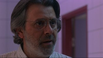 Movie still from “Open Your Eyes” (1997), directed by Alejandro Amenábar – A person wearing glasses; Close Up shot, Over the shoulder angle