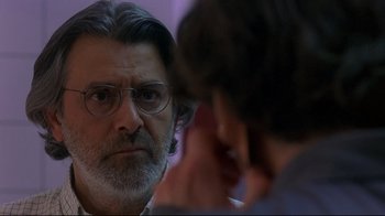 Movie still from “Open Your Eyes” (1997), directed by Alejandro Amenábar – An older man looking at himself in the mirror; Close Up shot, Over the shoulder angle