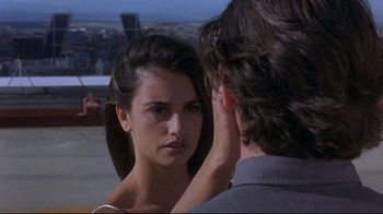 Movie still from “Open Your Eyes” (1997), directed by Alejandro Amenábar – A woman looking into a mirror while a man looks on; Close Up shot, Over the shoulder angle