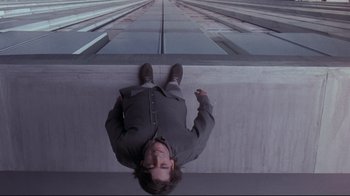 Movie still from “Open Your Eyes” (1997), directed by Alejandro Amenábar – A man laying on the ground looking up; Wide shot, Overhead angle