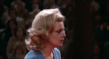 Movie still from “Opening Night” (1977), directed by John Cassavetes – A woman with blonde hair is looking to the side; Close Up shot, Over the shoulder angle