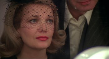 Movie still from “Opening Night” (1977), directed by John Cassavetes – A person wearing a veil; Close Up shot, Over the shoulder angle