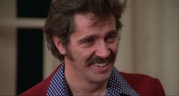Movie still from “Opening Night” (1977), directed by John Cassavetes – A person with a mustache; Close Up shot, Low angle