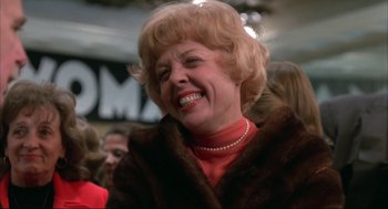 Movie still from “Opening Night” (1977), directed by John Cassavetes – An older woman wearing a red shirt and a fur coat; Close Up shot, Low angle