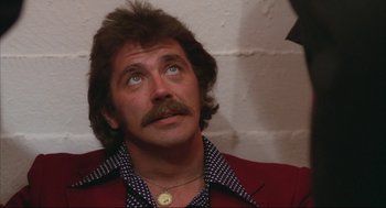 Movie still from “Opening Night” (1977), directed by John Cassavetes – A person wearing a jacket; Close Up shot, Low angle