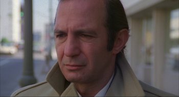 Movie still from “Opening Night” (1977), directed by John Cassavetes – A person wearing a coat; Close Up shot, Low angle