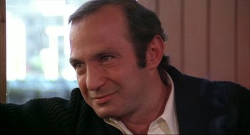 Movie still from “Opening Night” (1977), directed by John Cassavetes – A person wearing a jacket; Close Up shot, Low angle