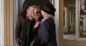 Movie still from “Opening Night” (1977), directed by John Cassavetes – Two women are talking to each other in a hallway; Medium shot, Over the shoulder angle