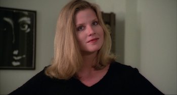 Movie still from “Opening Night” (1977), directed by John Cassavetes – A woman with long blonde hair wearing a black shirt; Close Up shot, High angle