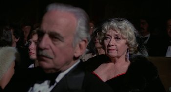 Movie still from “Opening Night” (1977), directed by John Cassavetes – An older man and a younger woman in formal wear; Close Up shot, Over the shoulder angle