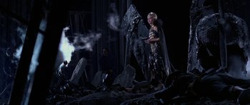 Movie still from “Opera” (1987), directed by Dario Argento – A woman standing in the middle of a pile of rubble; Wide shot, High angle