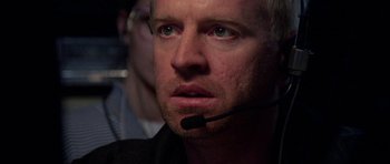 Movie still from “Opera” (1987), directed by Dario Argento – A person wearing a headset; Close Up shot, Low angle