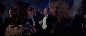 Movie still from “Opera” (1987), directed by Dario Argento – Two women in formal wear talking to each other; Close Up shot, Over the shoulder angle