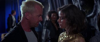 Movie still from “Opera” (1987), directed by Dario Argento – A man and a woman talking to each other; Close Up shot, Over the shoulder angle