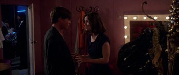 Movie still from “Opera” (1987), directed by Dario Argento – A man and a woman talking to each other; Medium shot, Over the shoulder angle