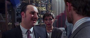 Movie still from “Opera” (1987), directed by Dario Argento – A man and a woman standing next to each other; Close Up shot, Low angle