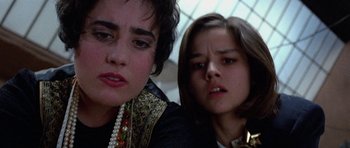 Movie still from “Opera” (1987), directed by Dario Argento – Two young women are looking at the camera; Close Up shot, Low angle