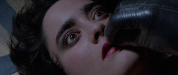 Movie still from “Opera” (1987), directed by Dario Argento – A person's eyes and mouth; Extreme Close Up shot, Overhead angle