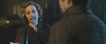 Movie still from “Oranges and Sunshine” (2010), directed by Jim Loach – Two people talking to each other in the dark; Close Up shot, Over the shoulder angle