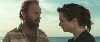 Movie still from “Oranges and Sunshine” (2010), directed by Jim Loach – A man and a woman are looking at each other; Close Up shot, Over the shoulder angle