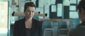 Movie still from “Oranges and Sunshine” (2010), directed by Jim Loach – A woman sitting in a chair in front of a window; Close Up shot, Over the shoulder angle