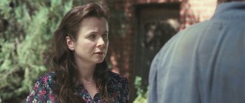Movie still from “Oranges and Sunshine” (2010), directed by Jim Loach – A person standing near another person; Close Up shot, Over the shoulder angle