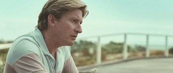 Movie still from “Oranges and Sunshine” (2010), directed by Jim Loach – A person with long blonde hair; Close Up shot, Over the shoulder angle