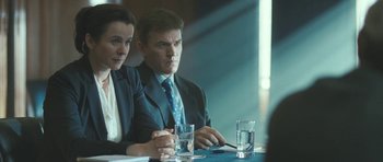 Movie still from “Oranges and Sunshine” (2010), directed by Jim Loach – A man and a woman sitting at a table; Medium shot, Over the shoulder angle