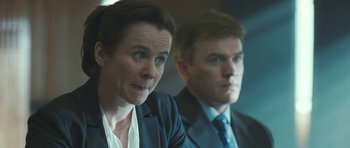 Movie still from “Oranges and Sunshine” (2010), directed by Jim Loach – A woman and a man in business suits; Close Up shot, Over the shoulder angle
