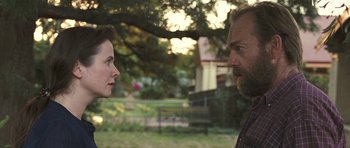 Movie still from “Oranges and Sunshine” (2010), directed by Jim Loach – A man and a woman talking in a park; Close Up shot, Over the shoulder angle